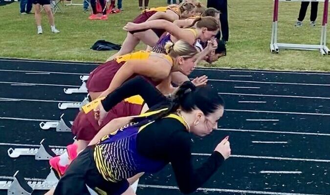 Coach Storbeck signals the start of the race at Thursdays Track and Field Meet. Photo by Shawna Wendler